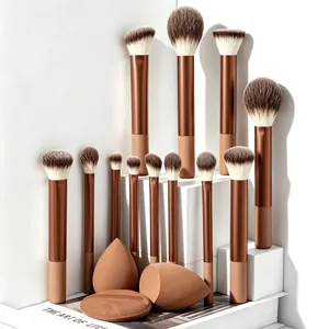 Complete 12-piece makeup brush set with beauty blenders on white geometric props