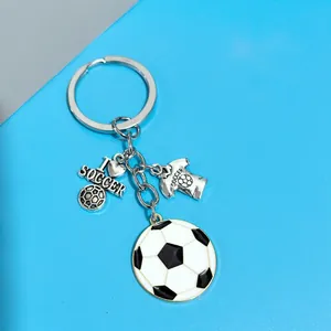 Soccer keychain set with ball, jersey, and I love soccer charm on blue grey backdrop