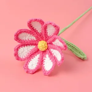 Handmade crochet rose bouquet in pink and white yarn with green stem and leaf