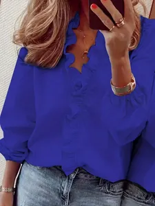 Chemise femme bleu roi à manches longues avec col à volants et poignets élastiques