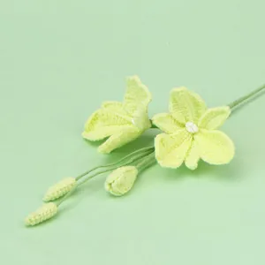 Handmade crochet light green rose bouquet with blooming flowers and buds for home decor