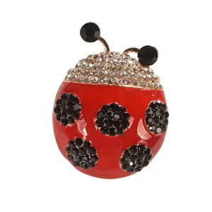 Vibrant red enamel ladybug brooch with black rhinestones and crystal accents