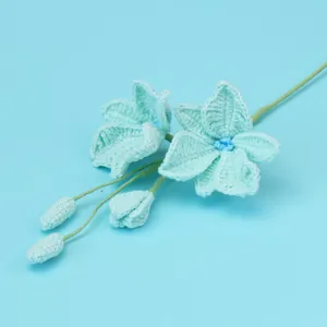 Handmade light blue crochet flower bouquet with two blooms and buds for home decor