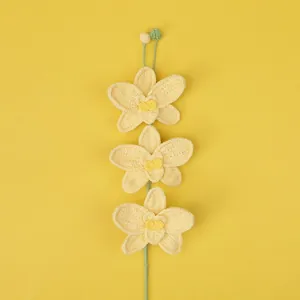 Handmade crochet orchid flower bouquet in light yellow yarn for home decoration