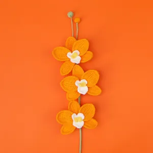 Handmade crochet orchid flower bouquet in vibrant orange color with green stem