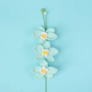 Handmade crochet orchid flower bouquet in mint blue with three blooms and small buds