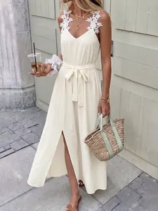 Detailed view of 3D lace flower straps on a creamy-white split summer midi dress