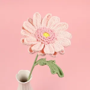 Handmade crochet gerbera flower in soft pink yarn with green leaf for home decor
