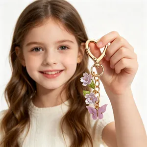 Porte-clés papillon et fleurs colorés avec fermoir cœur en métal doré et violet