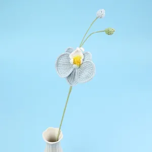 Handmade crochet orchid flower bouquet in light blue and white with green stem