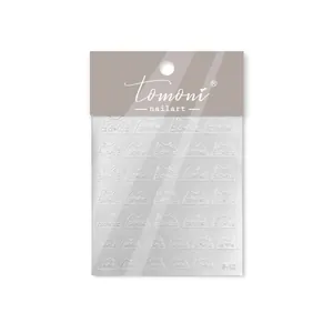 Detail of 3D embossed cat ear and face nail stickers with matte texture on backing card