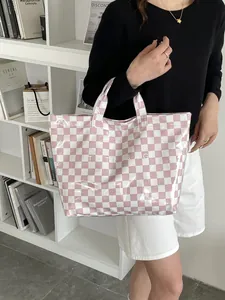 Detail of pink and white checkered tote bag with large TOTE BAG letter printing