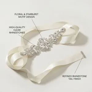 Detail of luxury bridal belt with starburst rhinestone pattern on ivory satin ribbon
