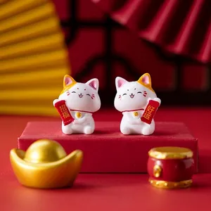 Cute lucky cat figurines with resin gold ingots and fan for desktop decoration