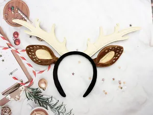 Close-up of plush reindeer antlers headband with soft fabric ears for Christmas decoration