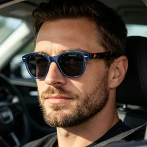 Close-up of polarized driving sunglasses with tortoise temples on a male driver