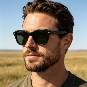 Close-up of polarized cat-eye sunglasses with green lenses and gold temple accents