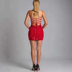 Elegant red backless mini dress with lace-up straps and floral jacquard texture