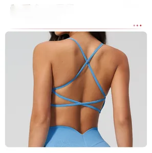 Detail of blue seamless yoga bra with criss-cross back straps and ribbed fabric
