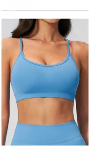 Detail view of sea blue seamless yoga bra with fine knit texture and ribbed hem