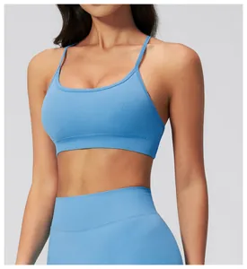 Detail view of seamless light blue yoga sports bra with ribbed hem and high waist leggings