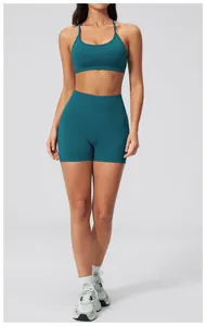 Detailed view of dark green seamless yoga set with U-neck sports bra and high-waist shorts