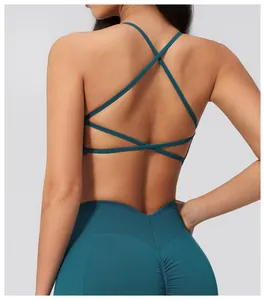 Detail of teal yoga set featuring criss-cross back straps and V-waist leggings