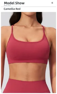 Detail view of camellia red seamless yoga bra with thin straps and ribbed band