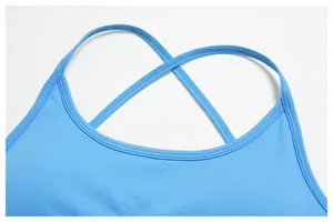 Macro detail of sky blue seamless yoga bra featuring breathable knit texture and thin straps