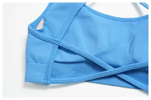 Close-up of seamless blue yoga bra with ribbed texture and cross-back strap detail