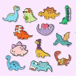 Set of 12 cute cartoon dinosaur enamel pins in various colors for clothing accessories