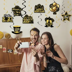 Models celebrating with 2027 New Year party hanging swirls and gold black decorations