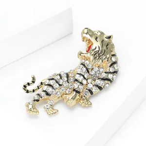 Close-up of a sparkling tiger brooch with clear rhinestones and black enamel detail