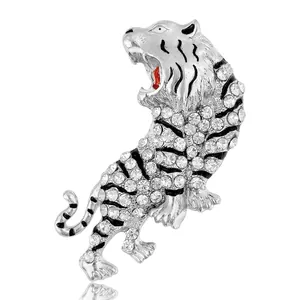 Sparkling silver tiger brooch with white rhinestones and black enamel tiger stripes