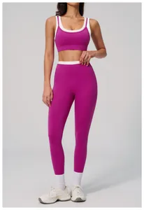 Close-up of rose red yoga set showing stitching detail on sports bra and leggings