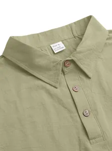 Detail shot of men's linen polo shirt collar with wood-style buttons and size L label