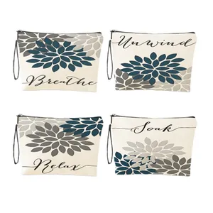 Set of four floral canvas makeup bags with Breathe, Unwind, Relax and Soak prints