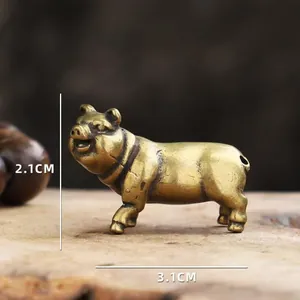 Detailed macro view showing the 2.1cm height and 3.1cm length of brass pig figurine