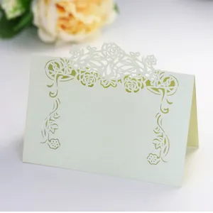 Detailed view of laser-cut floral patterns on premium pearlescent paper table card