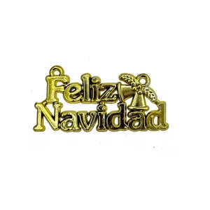 Close-up of golden Feliz Navidad hanging ornament with bells for Christmas wreaths