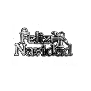 Detailed close-up of Feliz Navidad silver metal pendant with bell for Christmas decor