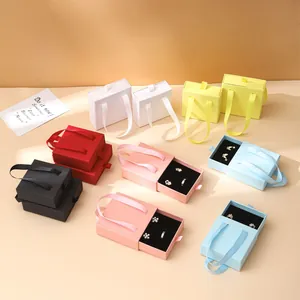 Colorful drawer style jewelry gift boxes with satin ribbon handles and velvet foam pads