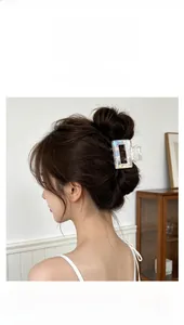 Close-up of iridescent rectangle hair claw clip with mosaic mini flash drill detail