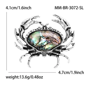 Broche crabe argentée créative avec nacre d'abalone, dimensions 4,7 cm x 4,1 cm