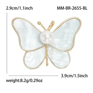 Golden butterfly brooch with blue marble texture wing and pearl center, size 3.9x2.9cm