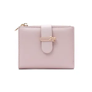 Close-up of pink PU leather wallet showing cross-grain texture and golden zipper