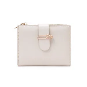 Detail of off-white short wallet with cross-grain texture and gold bow buckle