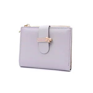 Detailed view of lavender PU leather wallet featuring a golden bow-knot buckle and zipper