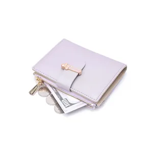 Close-up of light purple PU leather wallet with zipper pocket and metal snap closure