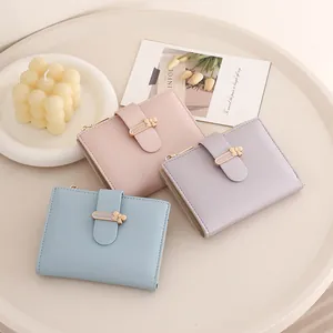 Three compact PU leather wallets in Morandi colors with bow snap and zipper detail